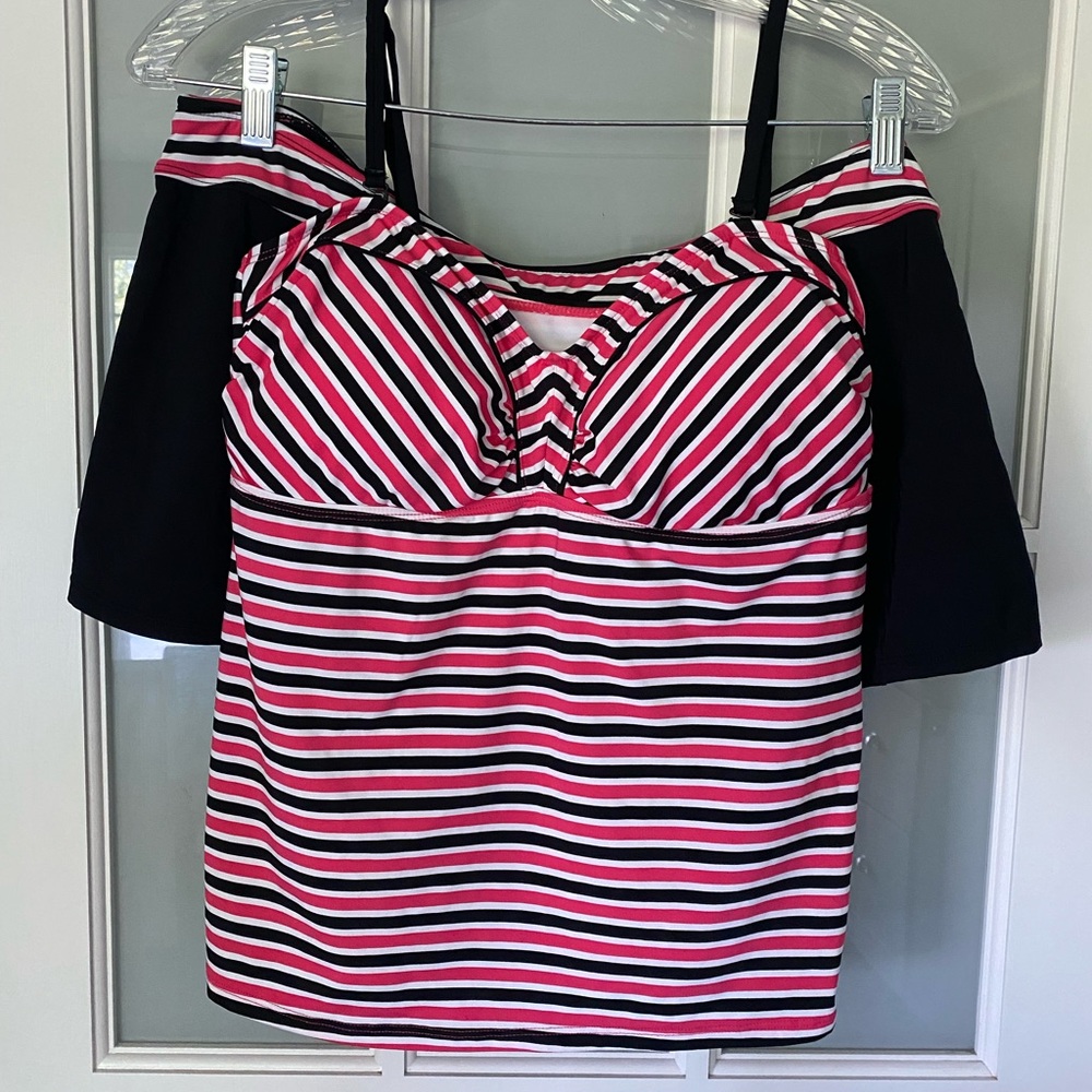 2 pc Tankini with side slit skirt and padded top and adjustable straps.